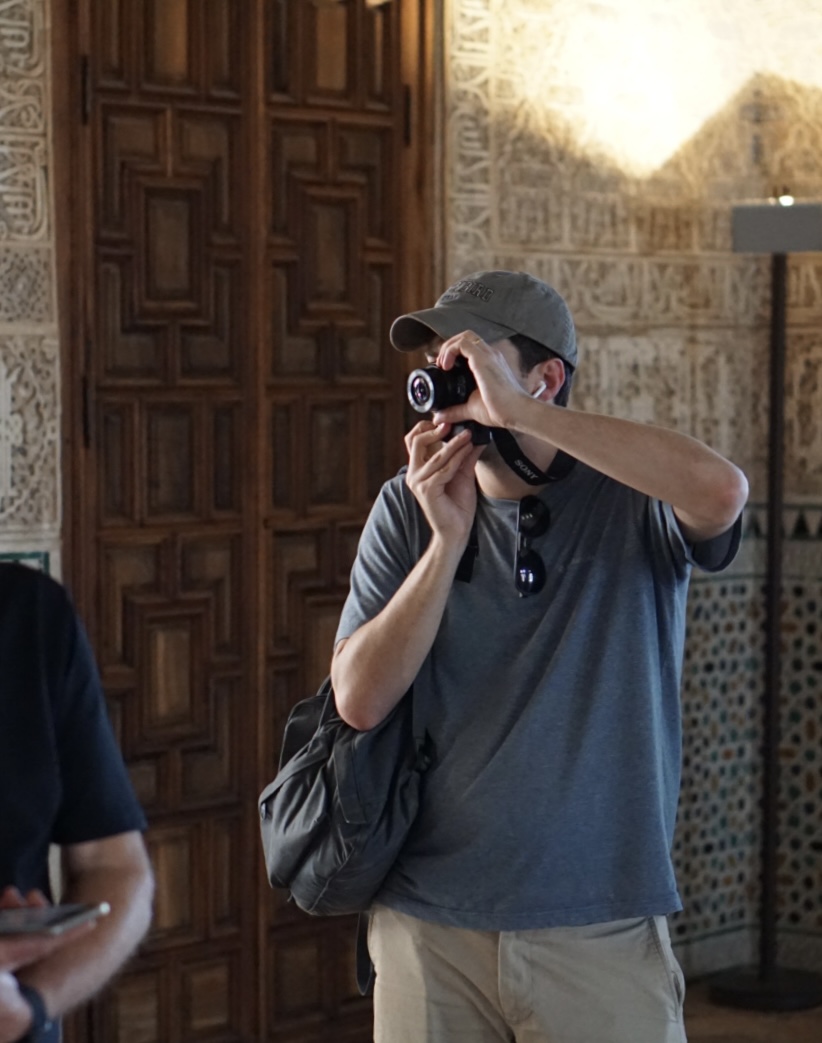 Photographer shooting inside the Alhambra palace in Spain with a compact Sony mirrorless camera